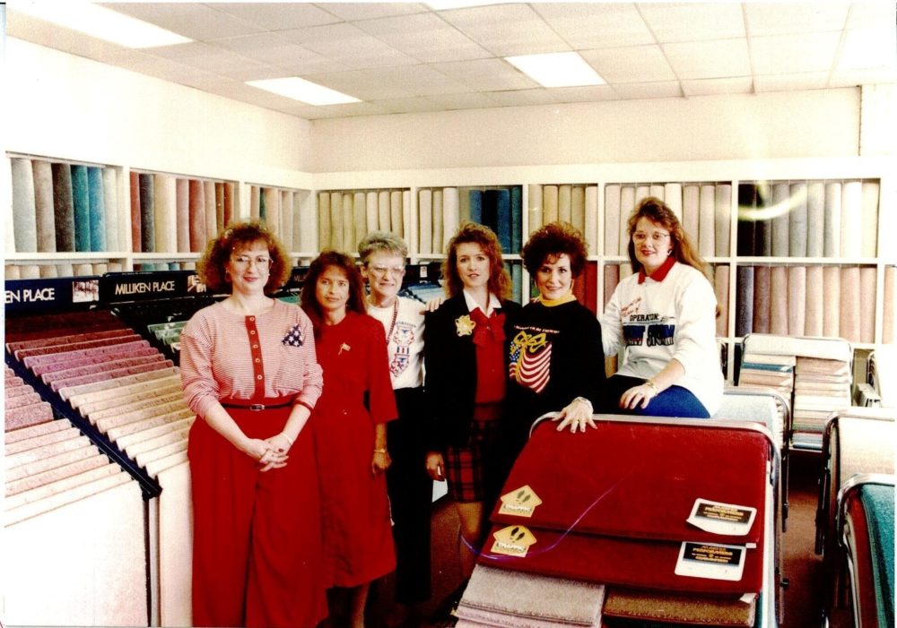 Members of The Carpet Shoppe team pose in the showroom in 1991.