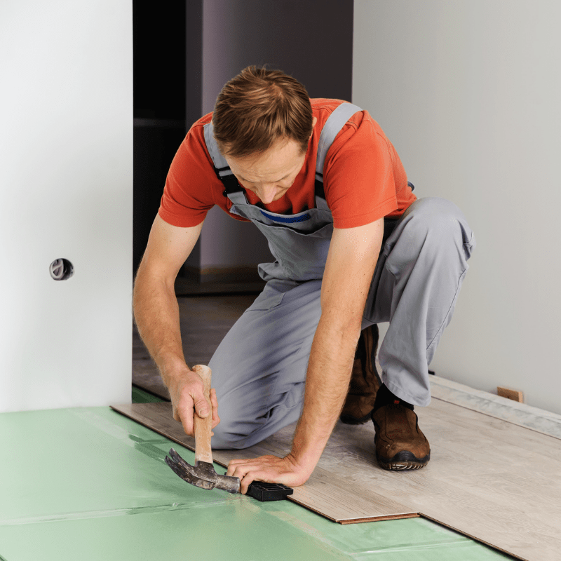 Man Laying Laminate Floor