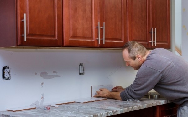 Man Planning Tile Layout